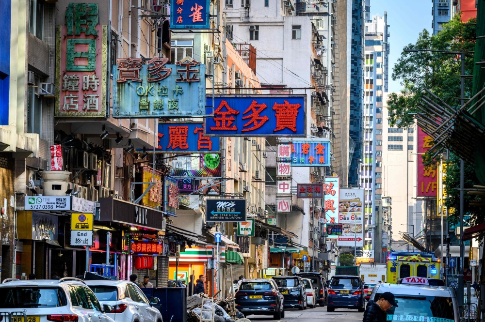 Neon signs are seen on a street in Hong Kong January 10, 2025. This is the second time Biden has extended the programme. He also did so for two years in 2022. — AFP pic