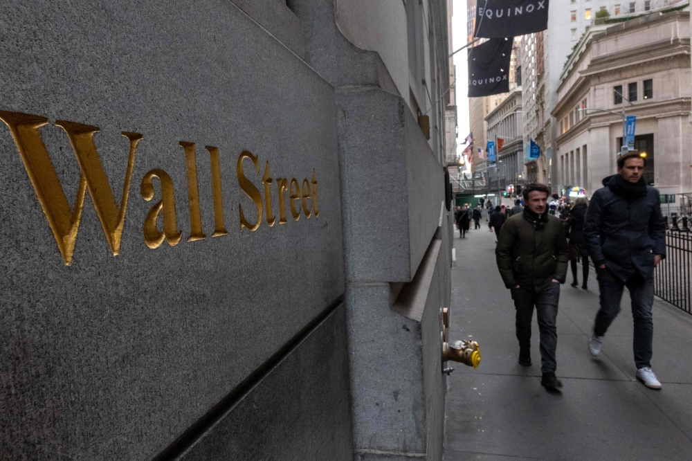 Strong earnings from Wall Street banking titans and a ceasefire deal between Israel and Hamas added to the optimistic mood on trading floors. — AFP pic