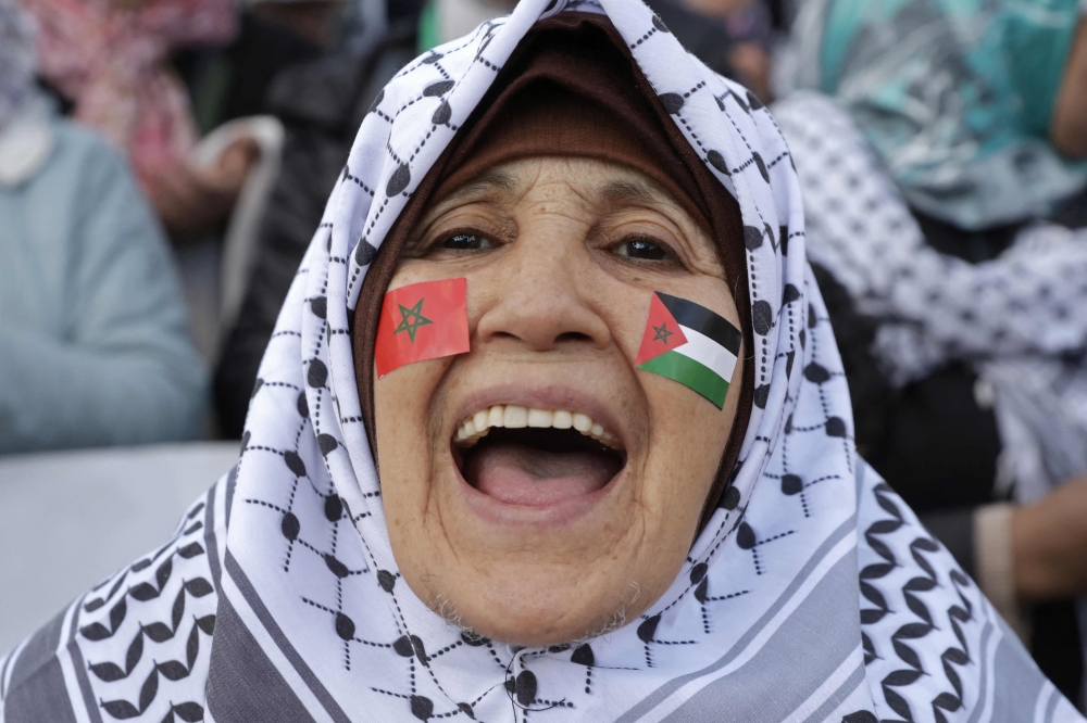A demonstrator shouts slogans as she arrives in front of the parliament building to express her support for the Palestinians, in Rabat on January 16, 2025, following the news of a ceasefire and hostage release deal between Hamas and Israel. — AFP pic