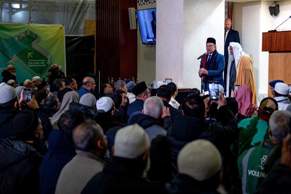 Anwar during a brief speech at the East London Mosque before joining congregants for Friday prayers yesterday. — Bernama
