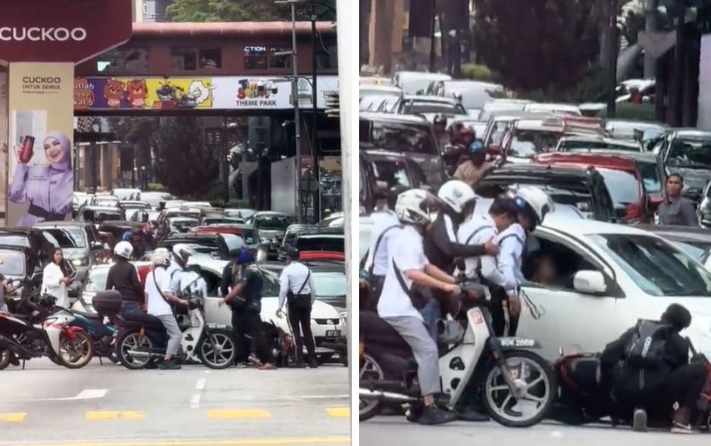 Police detained a 38-year-old woman after she drove dangerously and obstructed public servants on duty in Bukit Bintang, causing an accident and almost hitting a traffic police officer. — Pictures via TikTok/mhmmdjuraih
