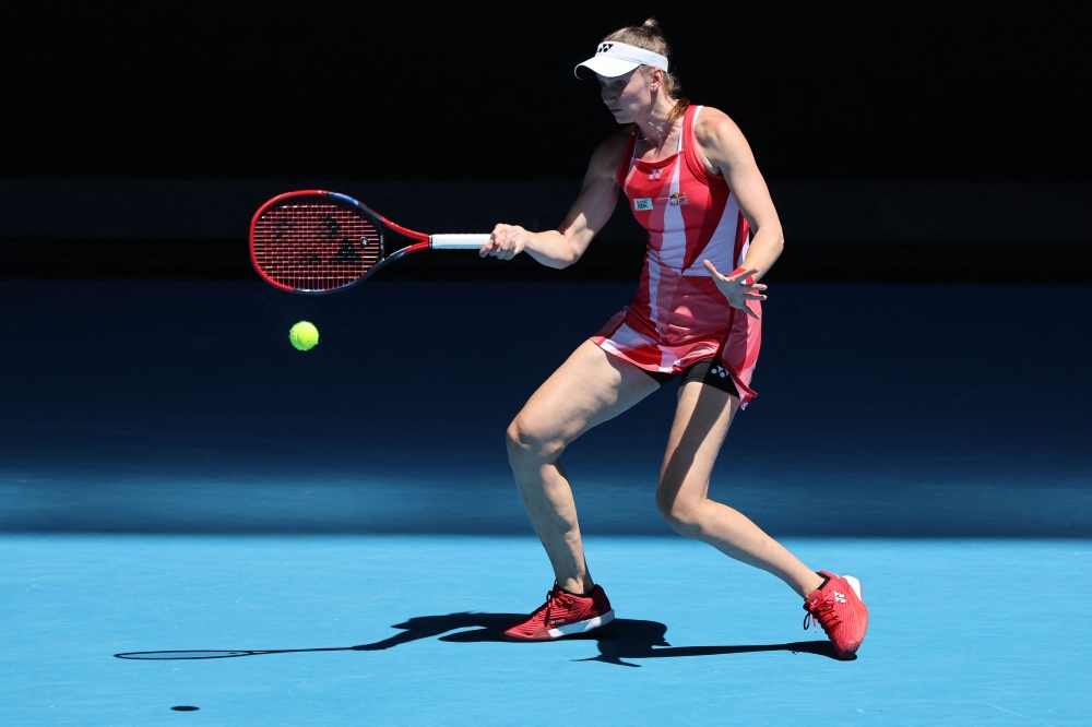 Kazakhstan's Elena Rybakina hits a shot against Ukraine's Dayana Yastremska during their women's singles match on day seven of the Australian Open today. — AFP pic