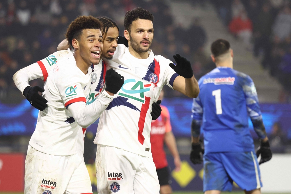 Paris Saint-Germain’s Bradley Barcola (second from left) celebrates with teammates after scoring a goal. — Picture from AFP