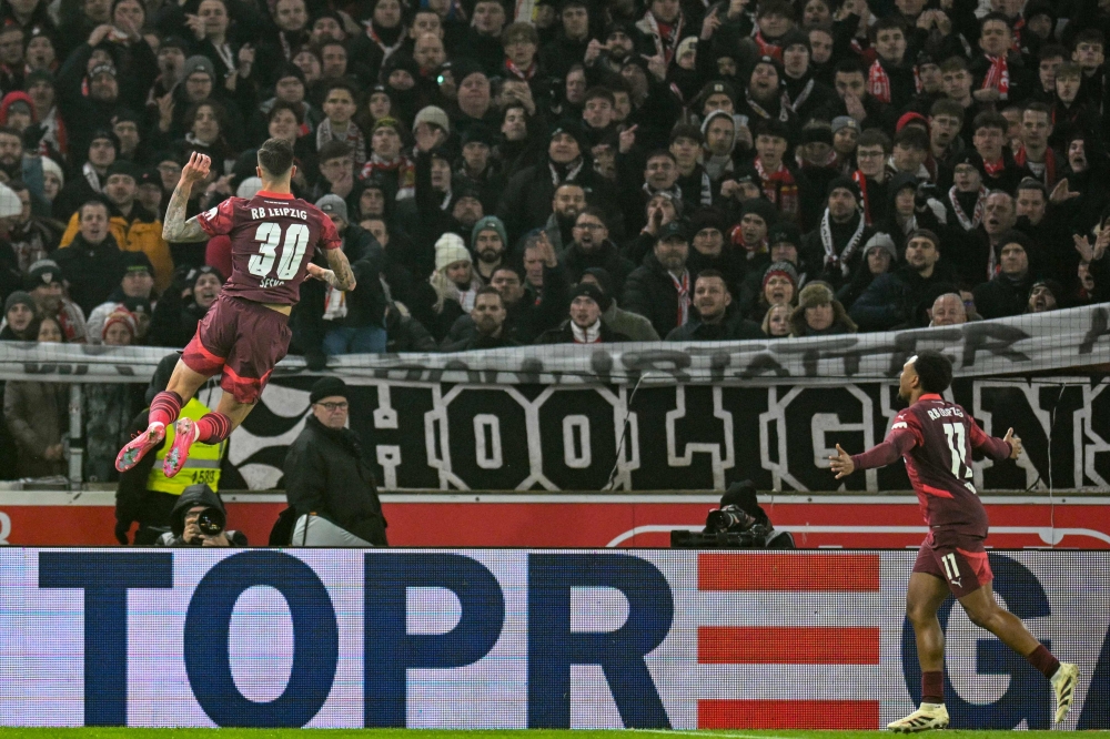 Leipzig’s Benjamin Sesko (L) celebrates scoring his team’s first goal. — Picture from AFP