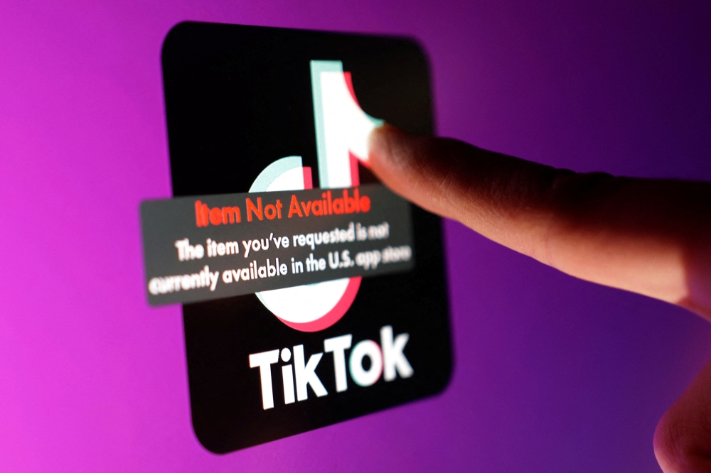 The TikTok app logo and an error message reading “Item Not Available” are seen in this illustration taken January 16, 2025. — Reuters pic