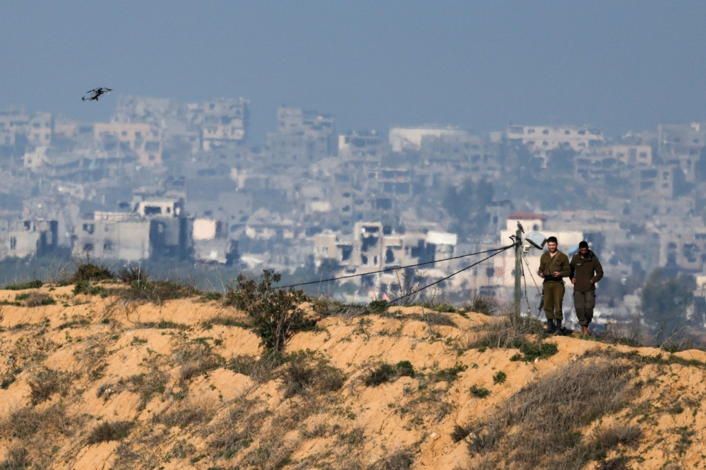 Israeli soldiers operate a drone on the Israeli side of the Israel-Gaza border, following a delay in the ceasefire. — Pic by Reuters
