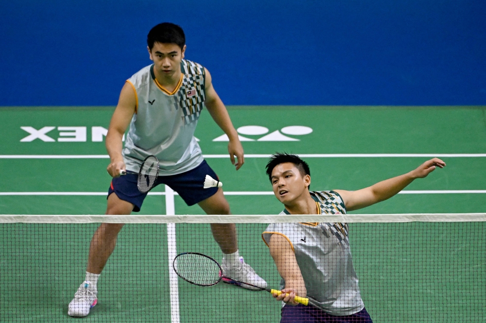 The world No. 2 pair fought through a tough three-game match to defeat South Korea’s Kim Won Ho and Seo Seung Jae, winning 21-15, 13-21, 21-16 in 52 minutes. — AFP pic