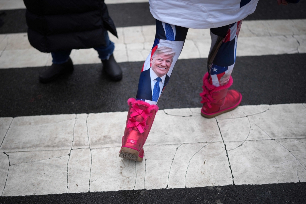 A supporter wearing Donald Trump leggings. — Pic by AFP
