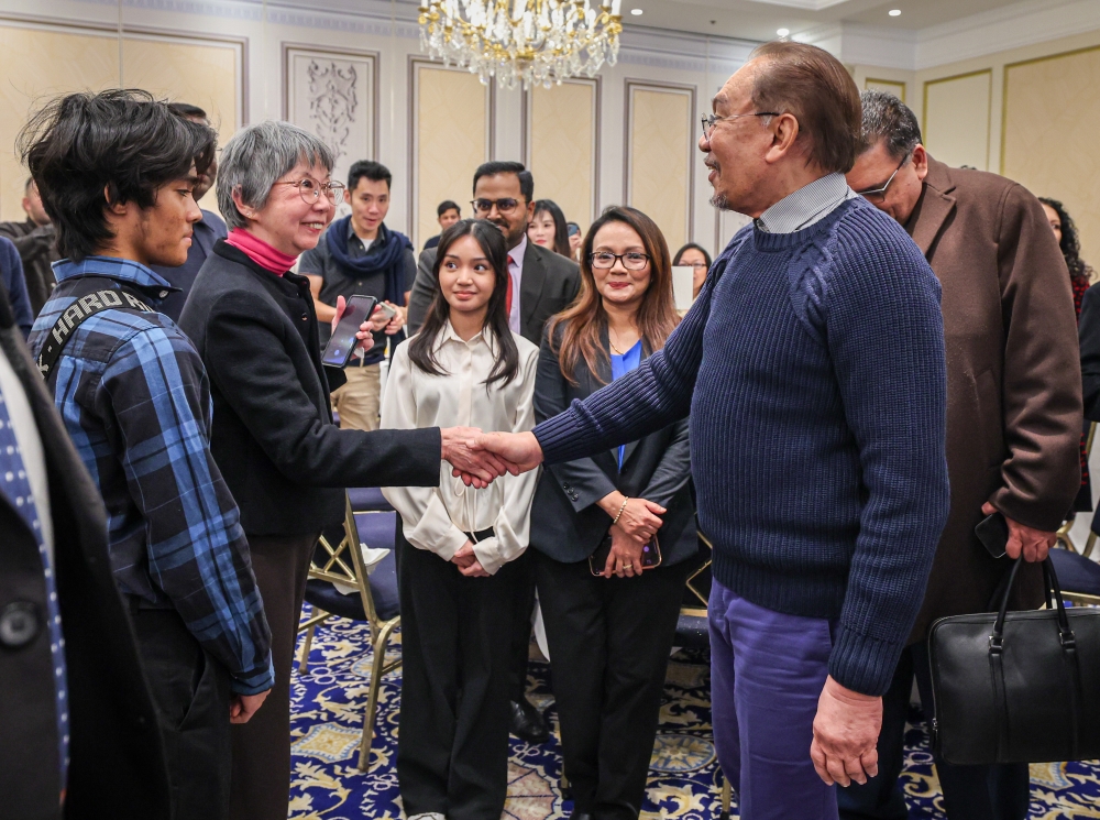 Prime Minister Datuk Seri Anwar Ibrahim interacts with members of the Malaysian diaspora in Belgium, in Brussels January 19, 2025. — Bernama pic