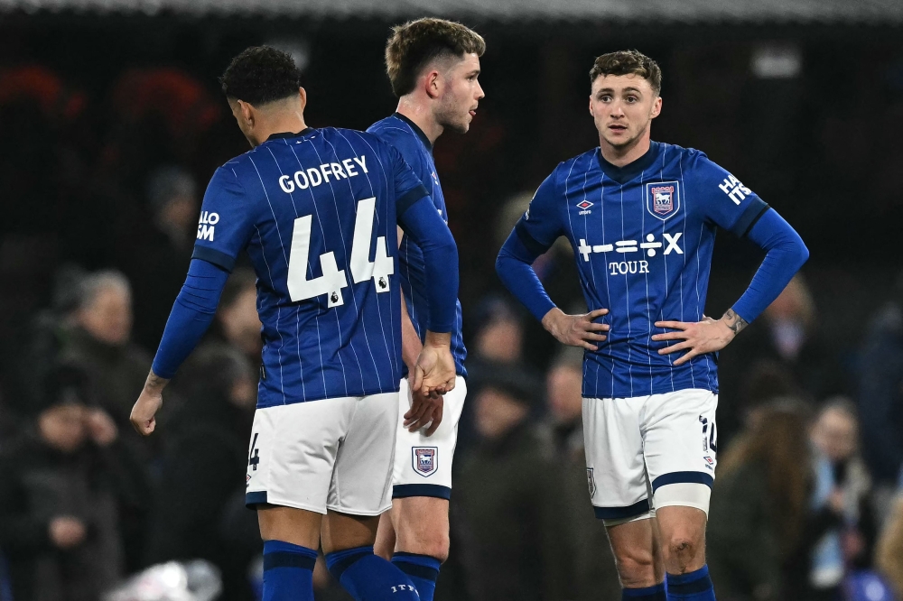Ipswich players react to their defeat to Manchester City at Portman Road. — Pic by AFP