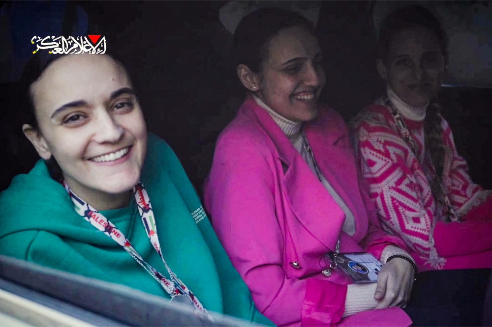 This image grab from a handout video released by the Hamas Media Office shows Israeli hostages (from left) Emily Damari, Romi Gonen, and Doron Steinbracher, who were abducted by Palestinian fighters during the October 7, 2023 attacks, sitting in a Hamas vehicle before being handed over to the International Committee of the Red Cross (ICRC) in the Gaza Strip on January 19, 2025 after a ceasefire and hostage-prisoner exchange deal in the war between Israel and Hamas was implemented. — AFP pic 