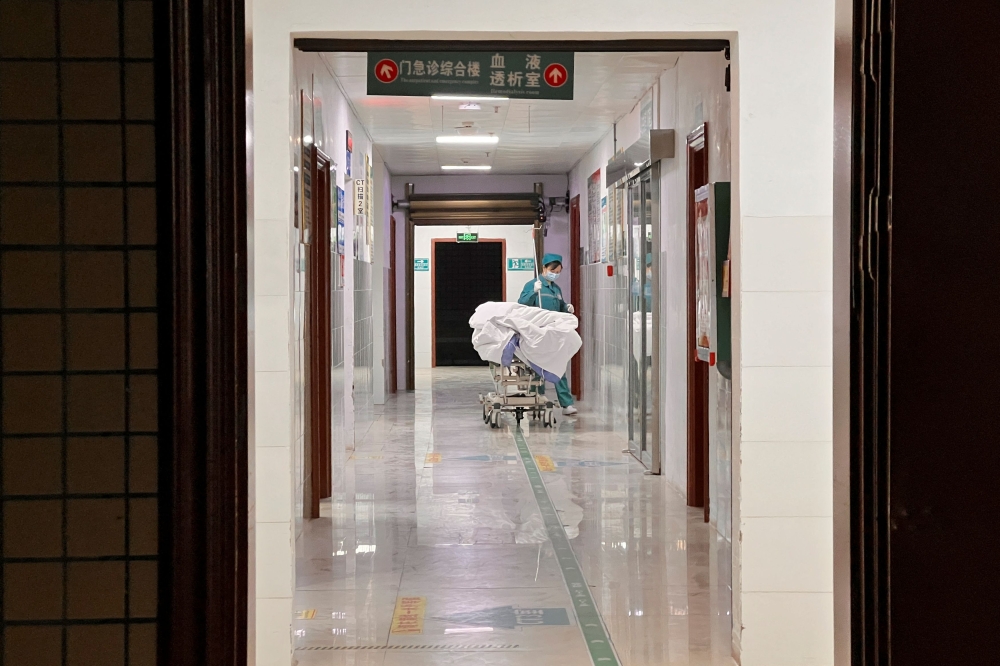 A nurse moves a bed through a corridor at a hospital in Duan Yao autonomous county in Guangxi region, China January 9, 2025. — Reuters pic 