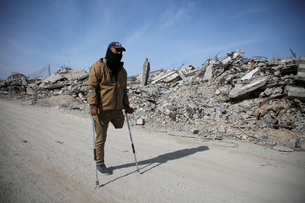A displaced Palestinian makes his way past rubble, as Palestinians attempt to return to their homes, following a delay in the ceasefire between Israel and Hamas over the hostage list, in Rafah, in the southern Gaza Strip January 19, 2025. — Reuters pic 