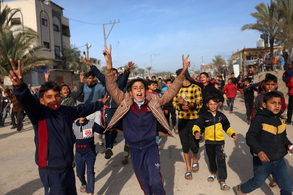 Children cheer in Nuseirat in the central Gaza Strip on January 19, 2025, shortly before a ceasefire deal in the war between Israel and the Palestinian group Hamas was implemented. — AFP pic 
