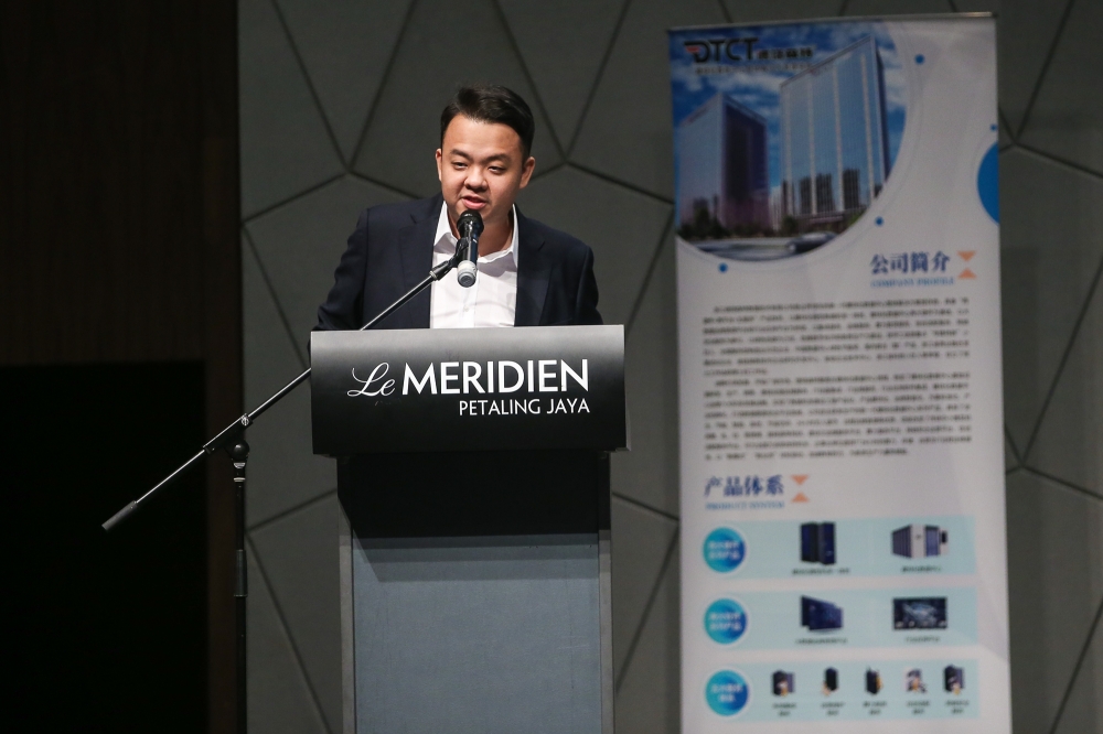 OGX Networks Sdn Bhd managing director Tan Suan Loong speaking at the signing ceremony with DTCT. — Picture by Yusof Mat Isa