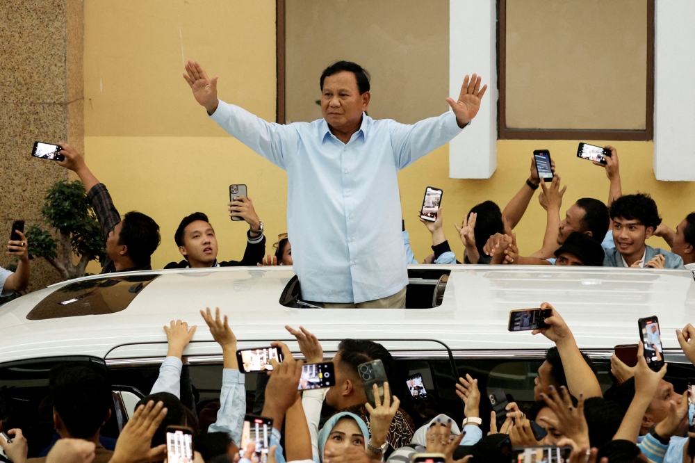 Prabowo Subianto waves to his supporters after attending his campaign rally in Jakarta, Indonesia, January 26, 2024. — Reuters pic
