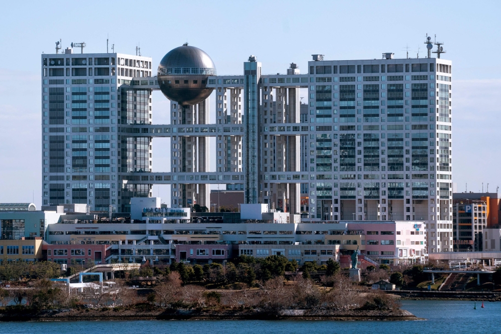 This file photo shows an exterior view of Japanese television station Fuji Television Network building in the Odaiba district of Tokyo on January 17, 2025. A growing number of top brands are pulling adverts from major Japanese broadcaster Fuji Television (Fuji TV) on January 20, 2025 over sexual misconduct allegations against a host and former J-Pop star. — AFP pic