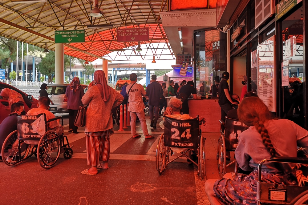 Long waiting times are the norm at public hospitals such as Kuala Lumpur General Hospital. Rakan KKM aims to elevate the public healthcare system by offering premium economy options. — Picture by Shafwan Zaidon  