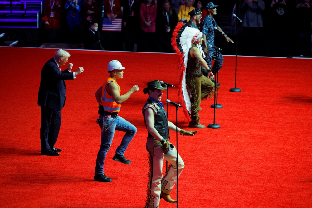 US President-elect Donald Trump dances onstage as the Village People perform during a rally the day before he is scheduled to be inaugurated for a second term, in Washington January 19, 2025. — Reuters pic  