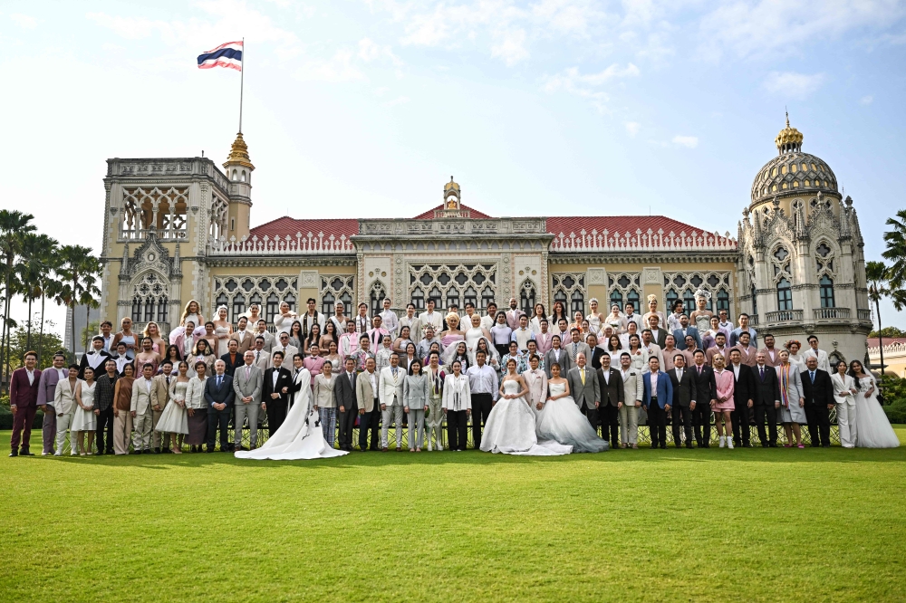 Thailand’s Prime Minister Paetongtarn Shinawatra, known by her nickname as ‘Ung Ing’ (centre) poses for photos with same-sex couples and members of LGBTQ community to promote ‘Marriage Equality Day’ at the Government House in Bangkok on January 15, 2025. — AFP pic 
