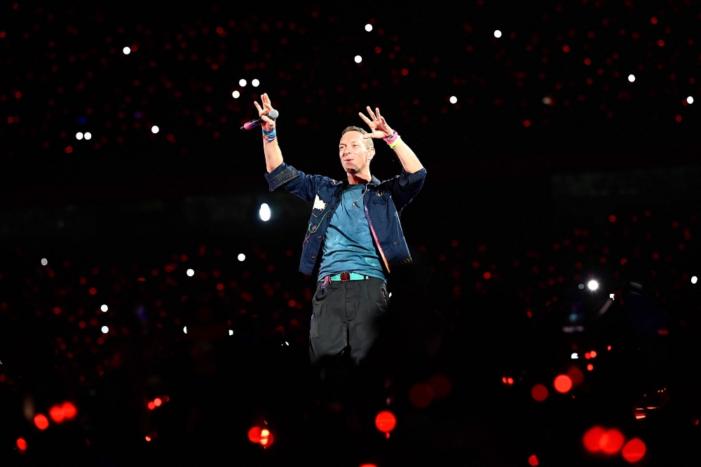 Chris Martin of the British rock band Coldplay performs onstage during a concert as part of their Music of the Spheres World Tour, in Navi Mumbai on January 18, 2025. — Reuters pic