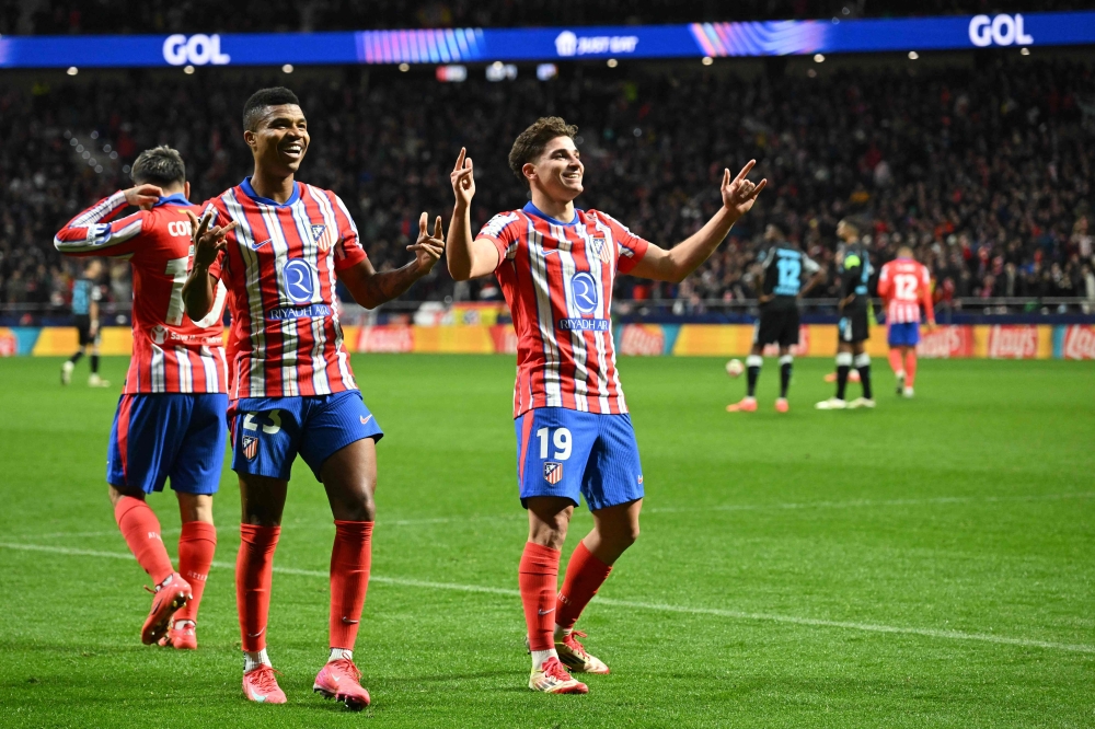 Atletico Madrid’s Julian Alvarez celebrates scoring his team’s second goal. — Pic by AFP