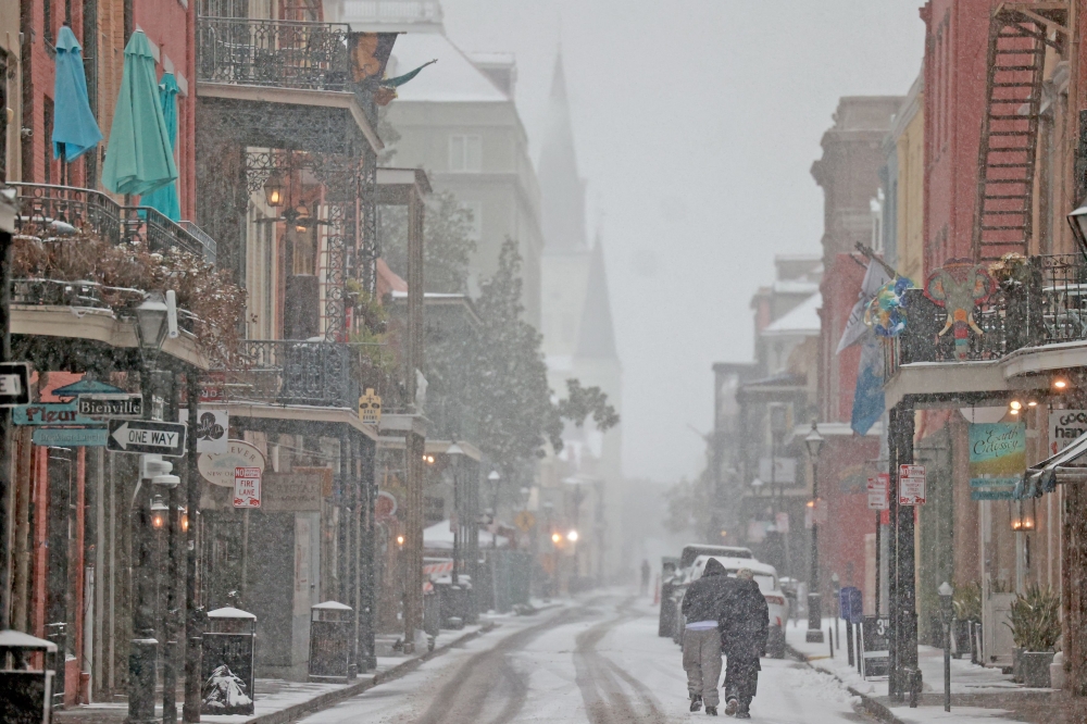 Snow falls on Chartres Street in the French Quarter in New Orleans, Louisiana. — AFP