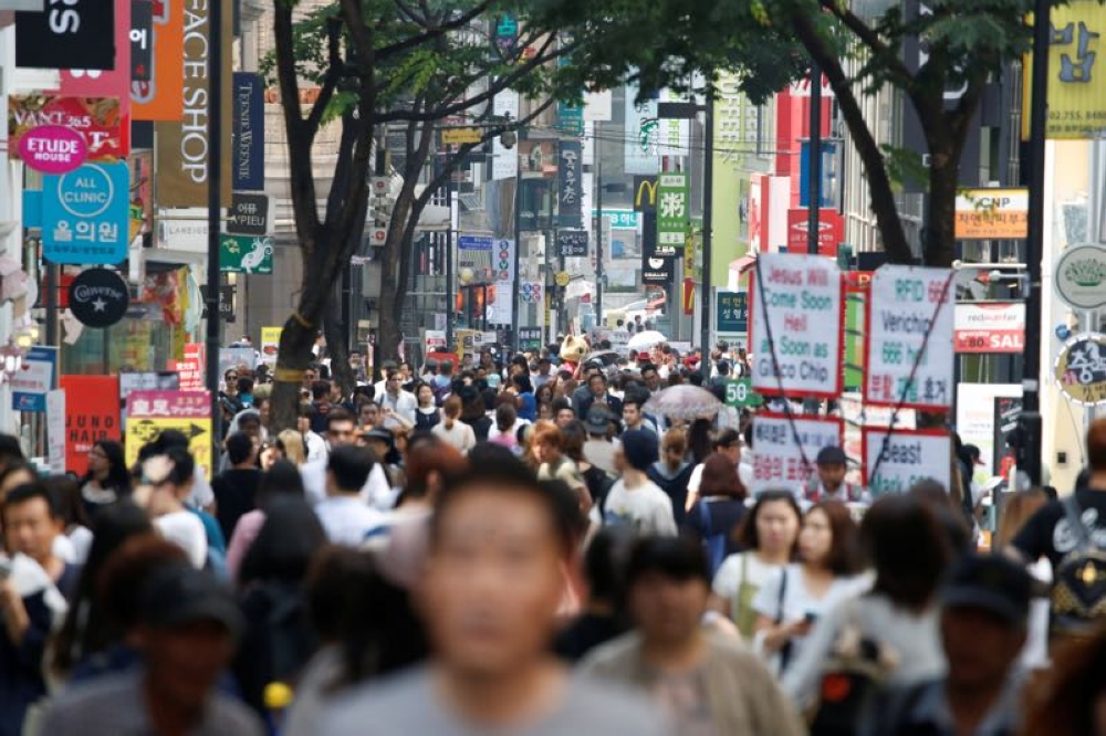 People walk in Myeongdong shopping district in Seoul, South Korea in this file picture dated June 1, 2016. The Asian country has recorded the world’s lowest fertility rates, but the number of newborns between January 2024 and November 2024 rose 3 per cent from a year earlier to 220,094, monthly government data showed on Wednesday. — Reuters pic