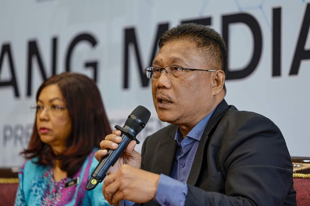 Chairman of the Independent Inquiry, Tan Sri Borhan Dolah, speaks during a press conference in Putrajaya January 22, 2025, which was held to announce the findings of its investigation into the death of pathologist Dr Tay Tien Yaa. — Bernama pic