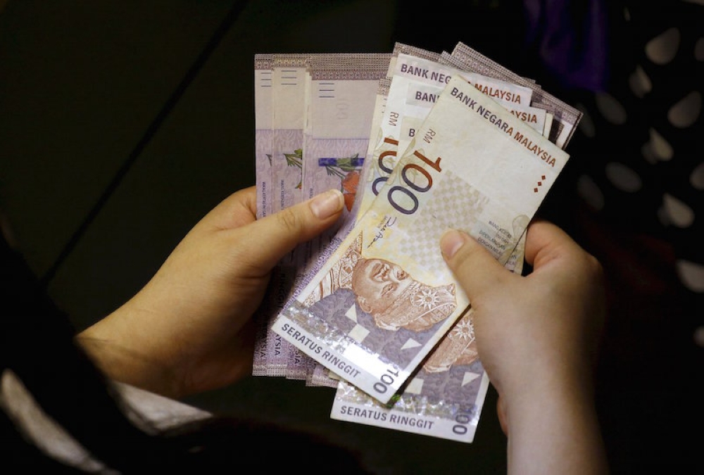 At 6pm, the ringgit gained to 4.4340/4400 versus the greenback from Tuesday’s closing of 4.4730/4780. — Reuters pic