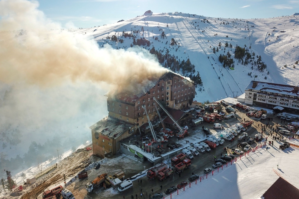 This handout photograph on January 21, 2025, shows an aerial view of a fire on the fourth floor of the 11-storey hotel in Bolu’s Kartalkaya ski resort. — DHA (Demiroren News Agency) handout pic via AFP 