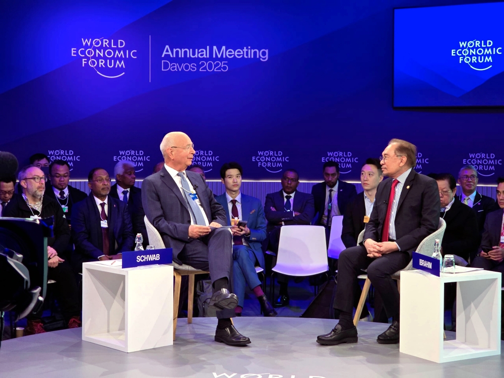 Prime Minister Datuk Seri Anwar Ibrahim (right) attends a forum in Davos, Switzerland, on Jan 22, 2025. — Bernama pic