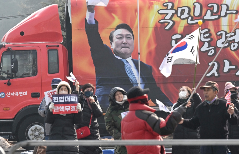 Supporters of arrested and impeached South Korean President Yoon Suk Yeol gathering outside the Seoul Detention Center in Uiwang yesterday— Pic by AFP
