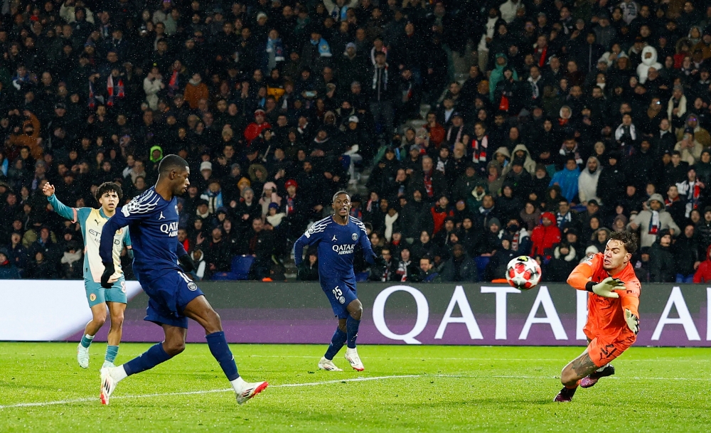Paris St Germain’s Ousmane Dembele scores a disallowed goal past Manchester City’s Ederson at Parc des Princes, Paris, January 22, 2025. — Reuters pic 