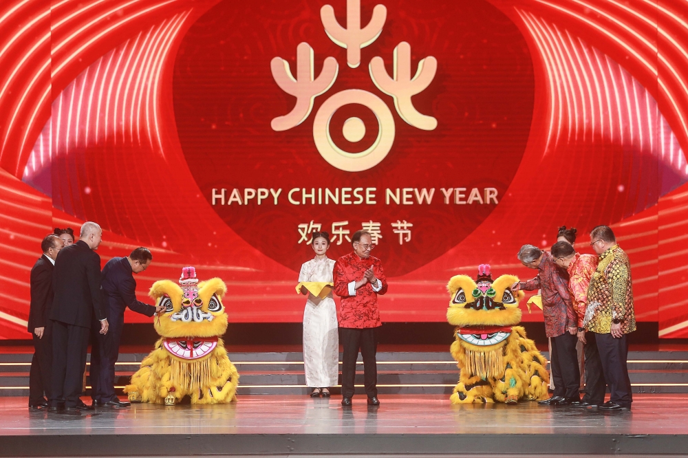 Prime Minister Datuk Seri Anwar Ibrahim joins lion dance performers during the Chinese New Year Celebration with MOTAC at Kuala Lumpur Convention Centre. — Picture by Sayuti Zainudin