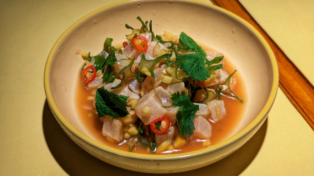 Barramundi Crudo, a refreshing dish that uses acidity to make you want to drink. — Picture by Ethan Lau