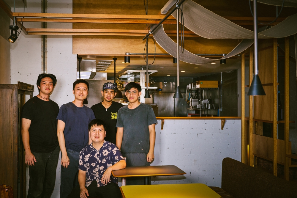 Chef Chong Yu Cheng, seated, with the kitchen team at Esca. — Picture courtesy of Esca