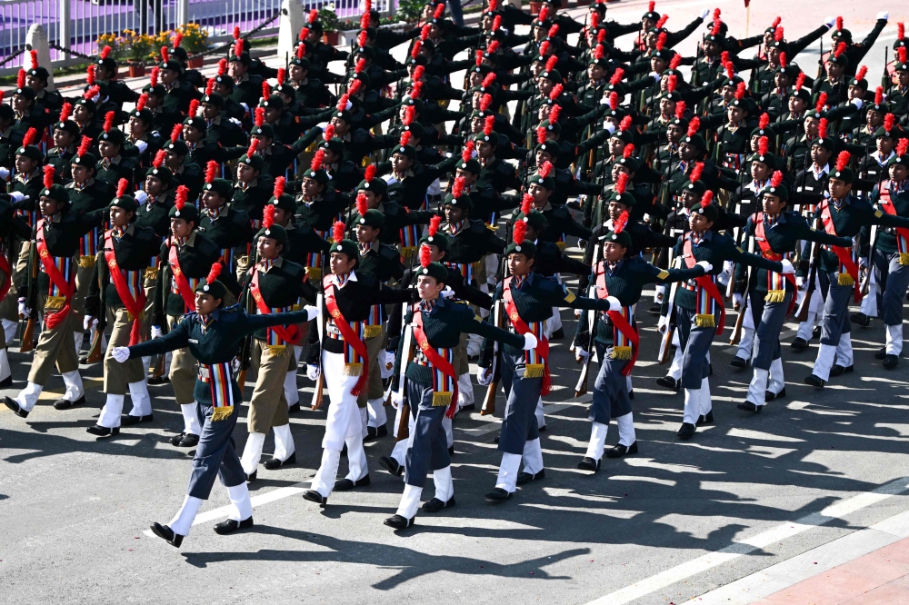 Contingents from India's National Cadet Corps take part in country's 76th Republic Day parade in New Delhi yesterday. — AFP pic