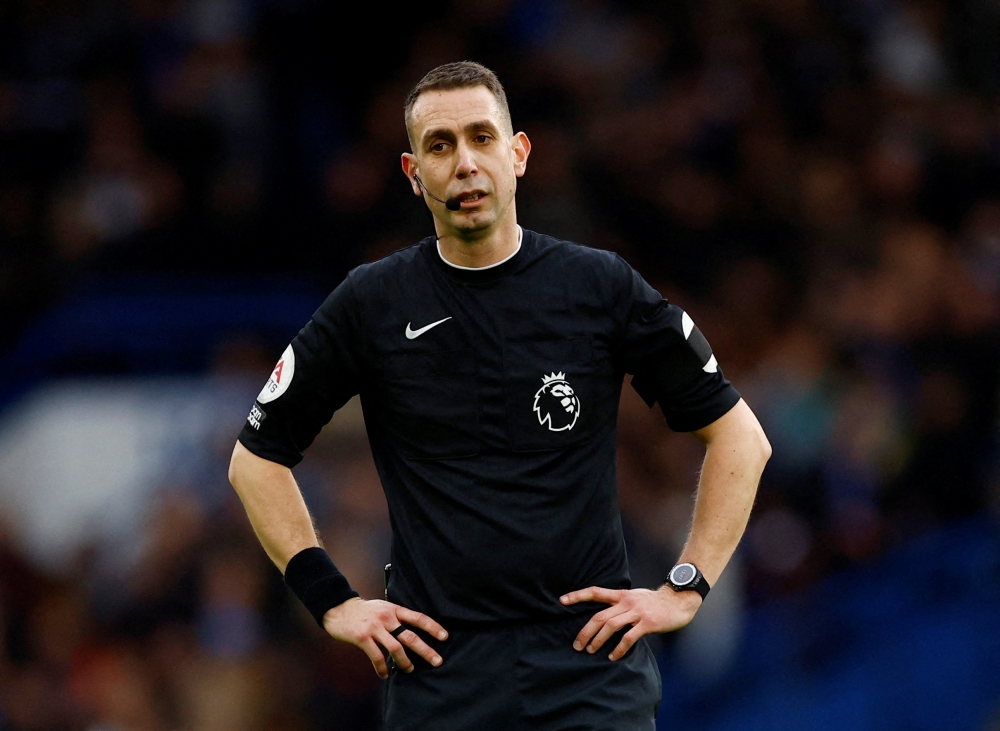 Former Premier League referee said he and his late mother had received death threats following decisions he had made on the pitch and cited his own example to show how relentless abuse from the stands and on social media could impact the mental health of officials. — Action Images via Reuters pic