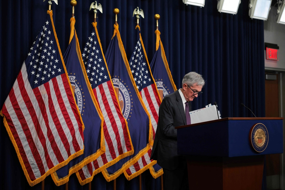 Jerome Powell US Federal Reserve Chairman, packs up his things after a press conference following a Federal Open Market Committee meeting at the Federal Reserve yesterday. — AFP pic