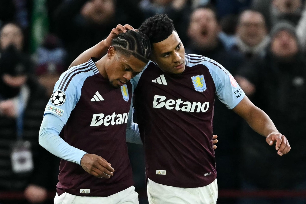 Aston Villa's English striker Ollie Watkins (right) celebrates scoring the team's third goal during the UEFA Champions League football match with Celtic at Villa Park in Birmingham, central England on January 29, 2025. — AFP pic