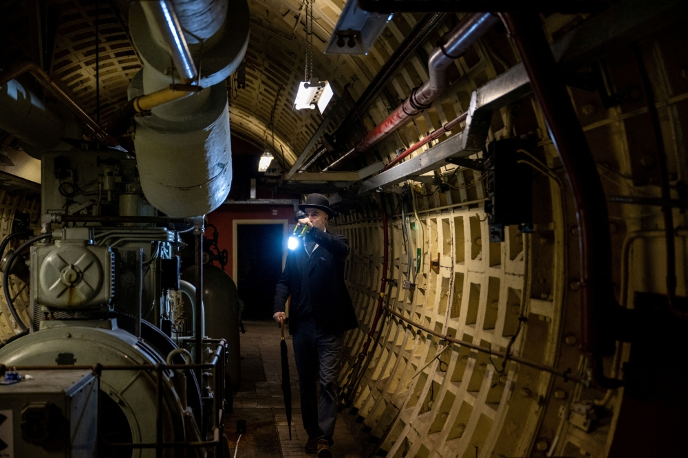 A journalist walks during a press tour of underground tunnels used during World War Two as shelters during the Blitz. — Reuters pic