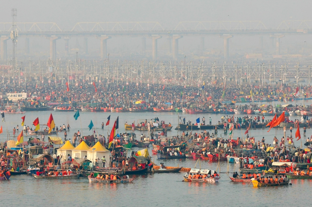 Hindu pilgrims arrive to take a dip in Sangam, the confluence of Ganges, Yamuna and mythical Saraswati rivers, on an auspicious occasion of 'Mauni Amavasya' during the Maha Kumbh Mela festival in Prayagraj on January 29, 2025. — AFP pic