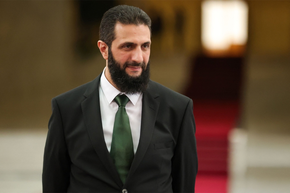 A handout picture released by Syria’s transitional government shows the country’s new leader Ahmed al-Sharaa waiting for the arrival of Spain’s foreign minister at the presidential palace in Damascus on January 16, 2025. Syria’s new authorities announced on January 29, 2025, that Ahmed al-Sharaa, who took the helm after longtime ruler Bashar al-Assad’s ouster last month, was appointed interim president and tasked with forming a transitional legislature, state media reported. — Syria’s Transitional Government handout pic via AFP 