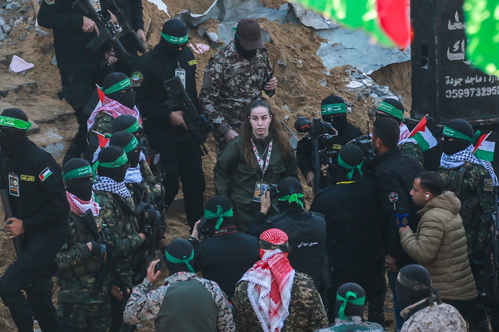 Palestinian group Hamas handed over Israeli woman soldier Agam Berger on Thursday as the third hostage-prisoner exchange of the Gaza ceasefire got under way. — AFP pic