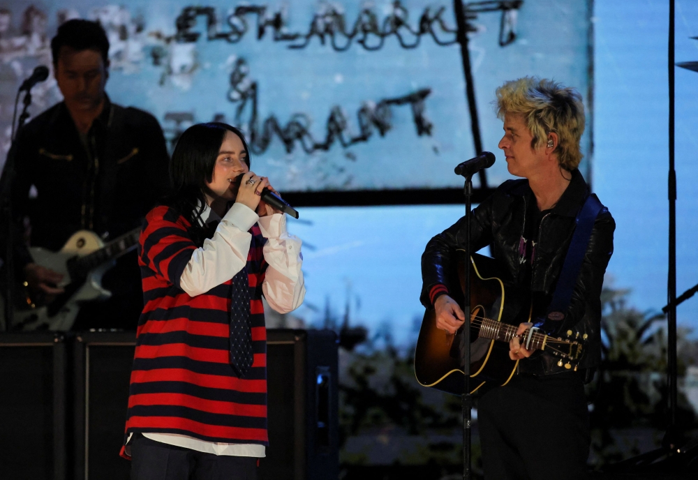 Billie Joe Armstrong of Green Day and Billie Eilish perform during the FireAid benefit concert for Los Angeles wildfire relief efforts. — Pic by Reuters