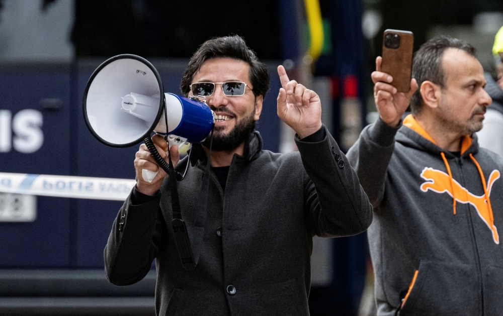 At his protests, Salwan Momika, often sporting square sunglasses, appeared defiant in the face of shouting counter-protesters, smirking in reaction to the obscenities shouted at him. — TT News Agency/Johan Nilsson handout pic via Reuters 