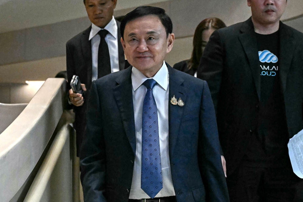 A Thai court on Friday granted former prime minister Thaksin Shinawatra permission to leave the country, a court statement said, a rare exception for a defendant facing royal insult charges. — AFP pic