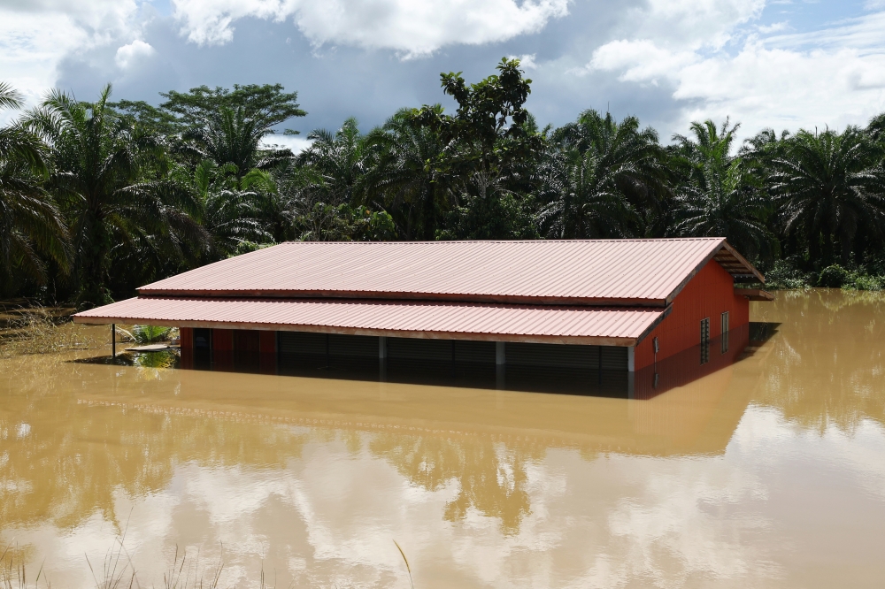 A house is submerged after the Labuk River overflowed, causing floods in Kampung Ganah Jati, Telupid in Sandakan January 30, 2025. — Bernama pic