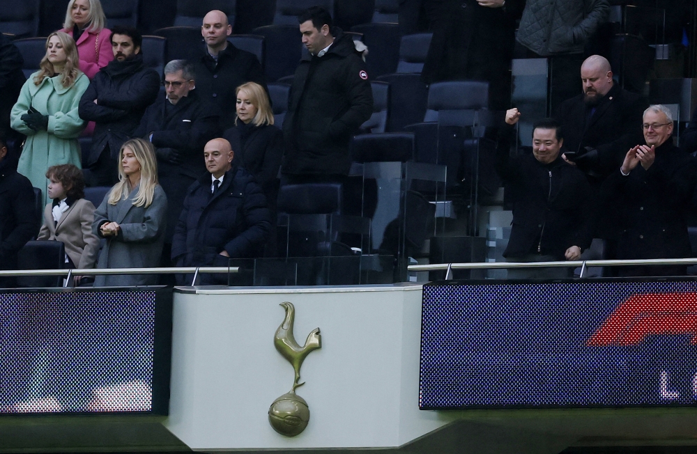 Tottenham Hotspur chairman Daniel Levy and his wife Tracy Dixon look dejected as Leicester City chairman Aiyawatt Srivaddhanaprabha celebrates in the stands after the match. — Reuters pic